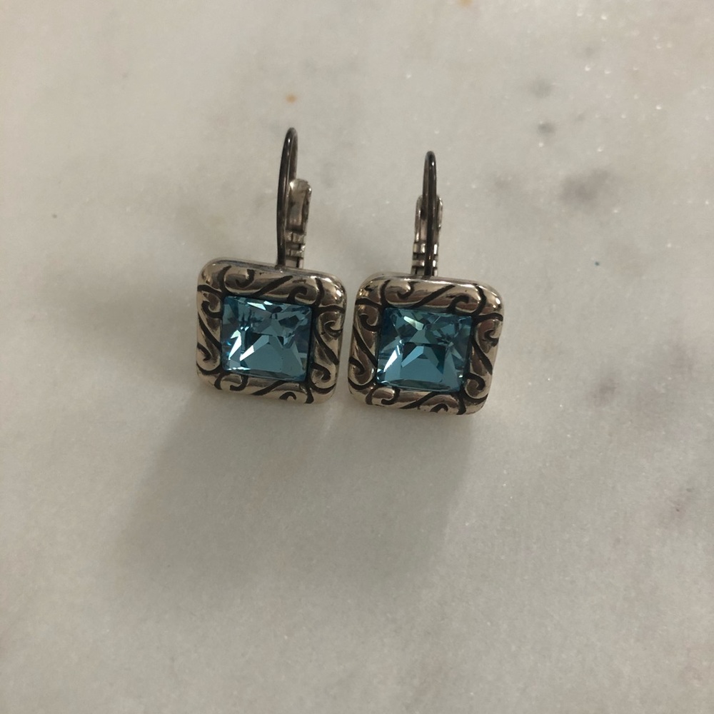 Silver and aquamarine colored earrings.
